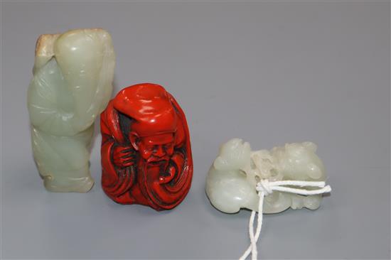 A Chinese carved jade group of two kylin, red lacquered and carved figure of a sage tallest 7cm